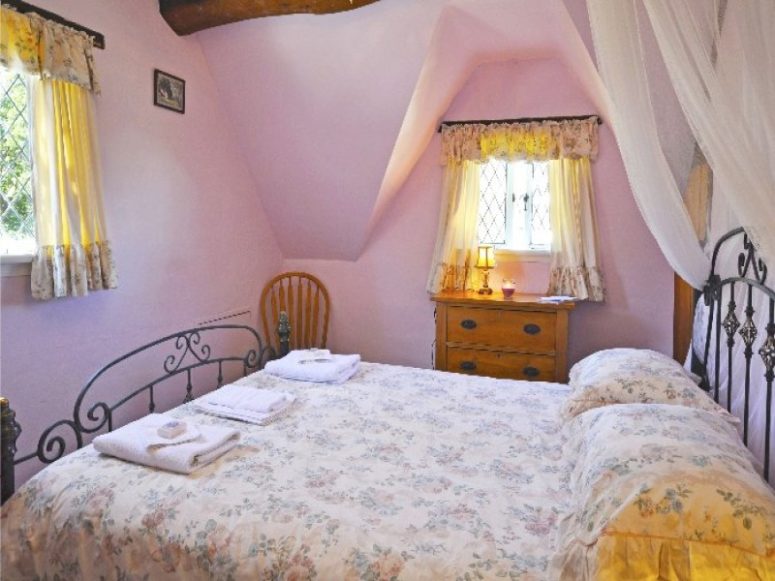 The second bedroom features a forged bed, some chairs and a dresser, the windows are small like everywhere else in the house The second bedroom features a forged bed, some chairs and a dresser, the windows are small like everywhere else in the house