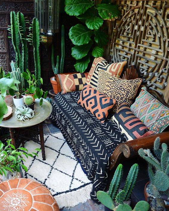printed colorful pillows and matching sofa upholstery make the space boho-like