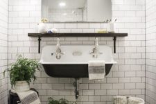 09 a vintage-inspired powder room in black and white, with white subway tiles with black grout