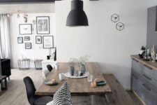 10 a contemporary dining space with a wooden table and bench plus black and white chairs for a fresh feel