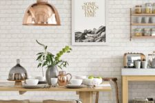 13 a Scandinavian kitchen with a white brick wall and neutral furniture, copper touches for a serene feel