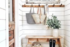 13 a cozy farmhouse entryway done with white shiplap plus a brick floor is a very chic and budget-friendly idea