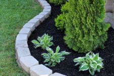 17 simple brick garden edging to highlight the raised garden bed and separate it from the lawn