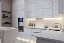 22 a kitchen ceiling highlighted with strip lights and upper cabinets accented with strip lighting, too, for more light in the cooking area