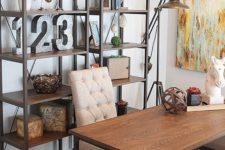 24 metal and wood free-standing shelving units that match the desk create a chic industrial feel in the home office