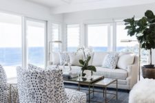 25 potted greenery here and there and white orchids make this living room feel luxurious and fresh