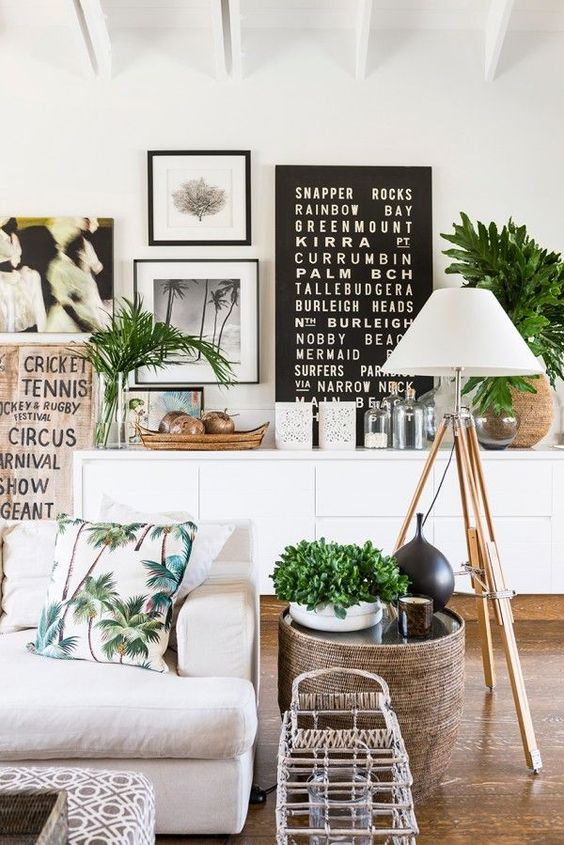 lots of greenery in pots and vases make the living room more welcoming and inviting