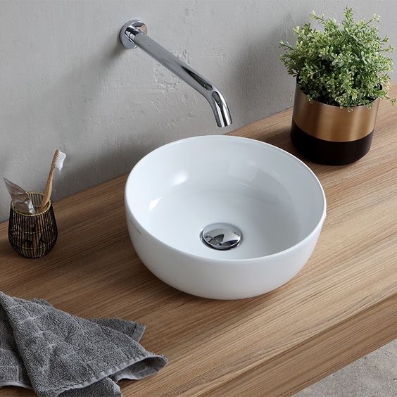 a classic small white vessel sink is a nice fit for a small powder room or a guest bathroom and will fit many styles