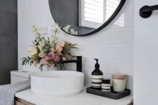 a classic white round vessel sink will never go out of style, pair it with black matte faucets for a contemporary space