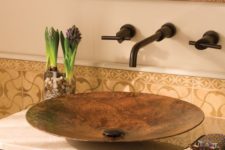 a sleek, contemporary copper vessel sink is wrought by master craftsmen using centuries-old techniques