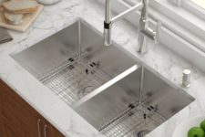 a white marble countertop with a double undermount sink for a contemporary or modern farmhouse kitchen