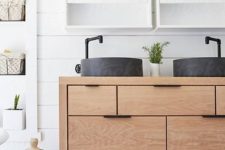 stylish matte black round vessel sinks with black faucets add drama to the neutral bathroom and make it chic