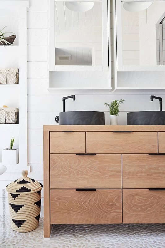 stylish matte black round vessel sinks with black faucets add drama to the neutral bathroom and make it chic