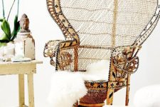 02 a peacock chair with yarn wrapping that adds a print to it, an amber leather ottoman and faux fur is impressive
