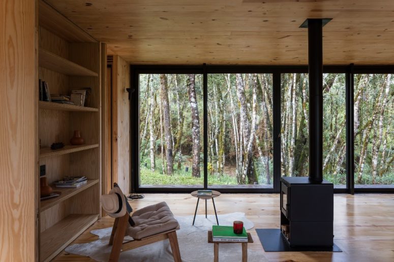 The interiors are done with light stained wood and plywood, there are glass walls that bring much light inside The interiors are done with light stained wood and plywood, there are glass walls that bring much light inside