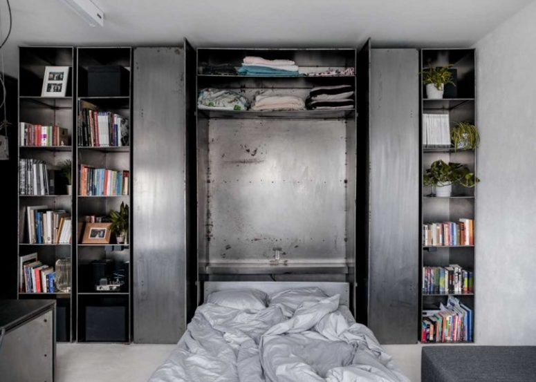 a practical storage unit with a Murphy bed inside This storage unit hides a Murphy bed inside it, which means maximal comfort while saving the space