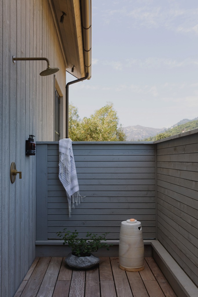 a small yet particle outdoor shower An outdoor shower is fully hidden for more privacy yet allows enjoying fresh air and showering outside