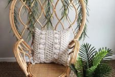 10 a catchy rattan peacock chair refreshed with interwoven greenery is a stylish idea with a modern twist