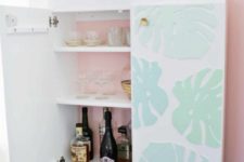 11 an IKEA Ivar cabinet turned into a stylish kid-proof home bar with dimensional monstera leaves and gilded legs