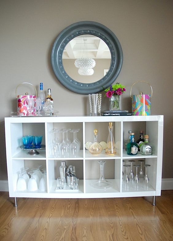 an IKEA Kallax shelving unit placed on legs is a cool idea with plenty of storage for all types of glasses