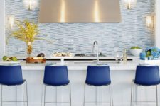 13 bright blue stools make a statement in the kitchen with their color and look wow