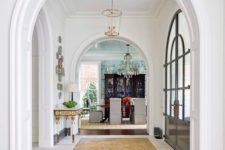 14 a very elegant and a bit formal entryway with arched doorways and arched doors for a refined look