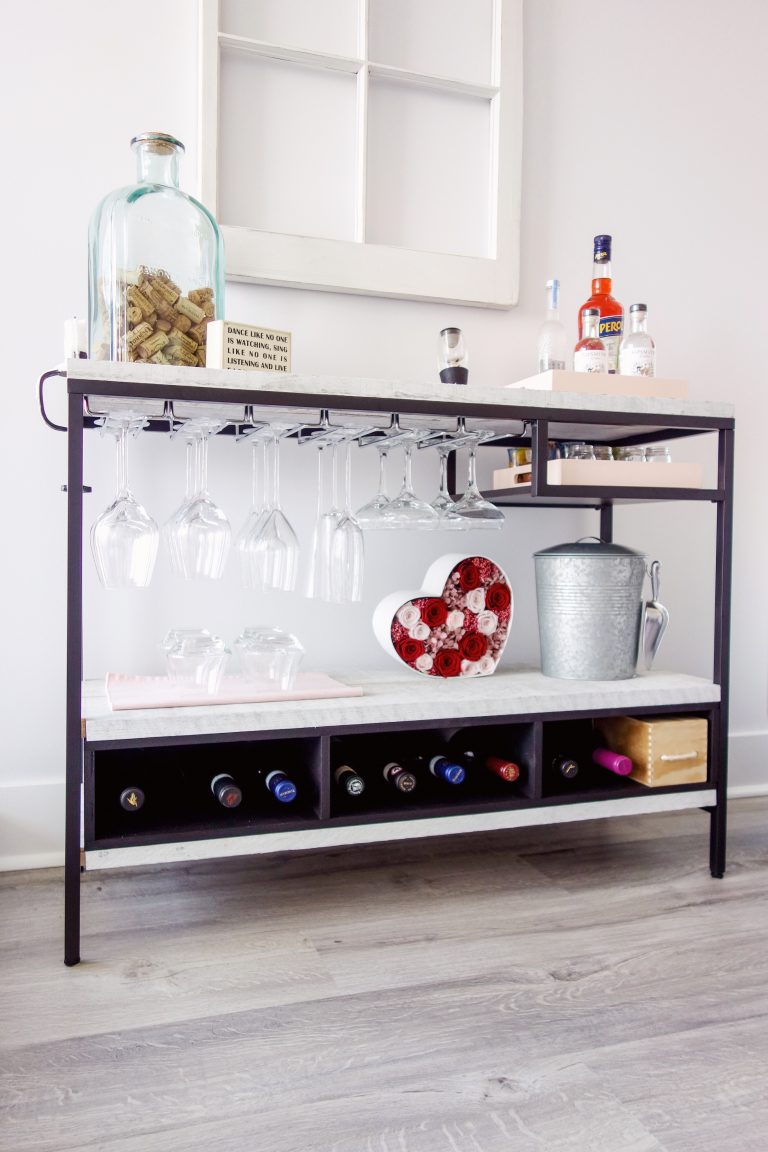 an IKEA Vittsjo hack into a stylish home bar with marble contact paper that covers plywood