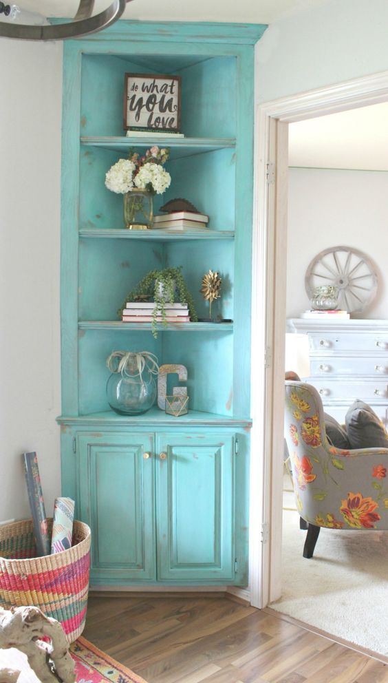 a turquoise shabby chic corner cabinet with open shelves and closed ones for a touch of color