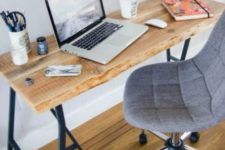 18 a rustic desk made of IKEA Lerberg Trestle Legs and a wooden tabletop with a living edge, which is a hot trend