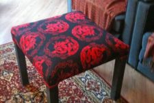 19 an IKEA Lack table renovated with bright black and red printed fabric on top to use as a footstool or ottoman
