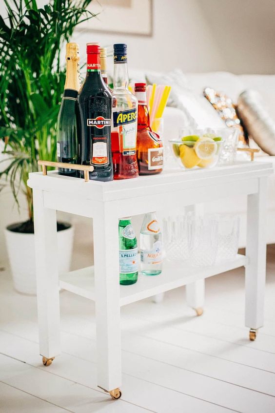 a wheeled trolley made from an unfinished Nornas side table with some brass accents is a very comfortable piece