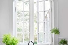 21 a beautiful arched window accents the farmhouse style and adds personality to the space