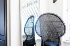 21 a single black peacock chair with black pillows will match a monochromatic space giving it a slight boho feel