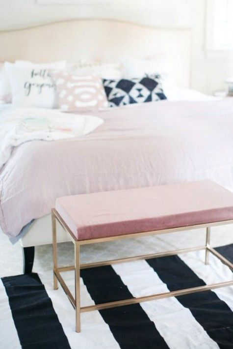 an IKEA Vittsjo table changed into a cool ottoman with a pink cushion and gold spray paint