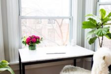 25 an IKEA Tarendo dining table hacked with marble contact paper into a simple desk