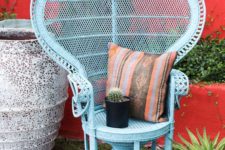 26 refresh your peacock chair with blue paint and a folksy pillow to make your boho nook more colorful