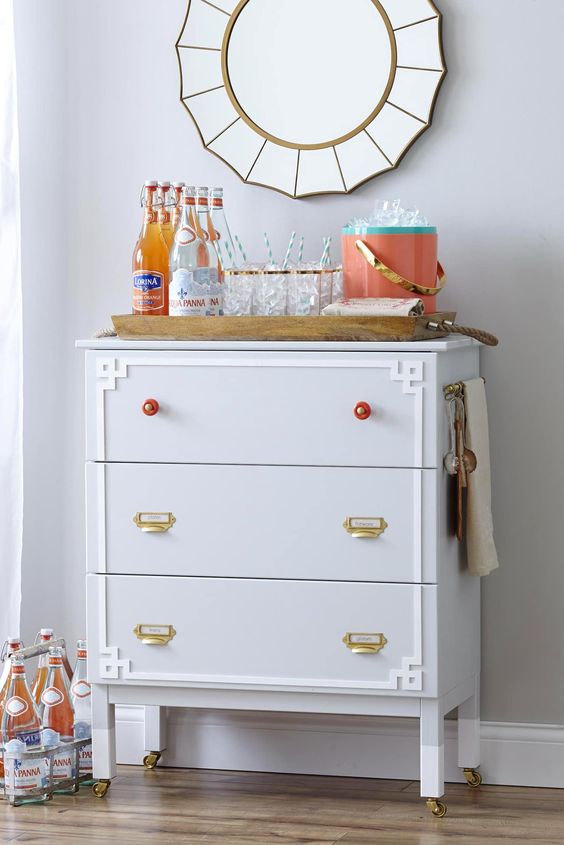 this IKEA Tarva dresser is adapted into a functional moveable entertaining station or bar with cool knobs and handles