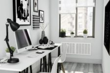 a small Scandinavian home office with a two black and white trestle desks, white chairs and black and white artworks