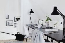 a welcoming Scandinavian space with a black desk and white chairs, black lamps and printed rugs