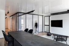 01 This chic minimalist apartment features a unique idea – a bedroom clad with a plastic box, which is a cool idea