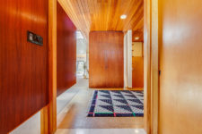 03 Cognac-toned and honey-toned wood is the key element of this home design and these two fill the spaces with warmth