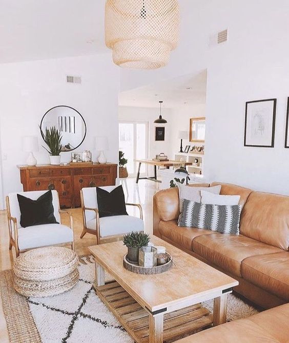 a large sectional sofa will accommodate a lot of people and you'll avoid cluttering your living room