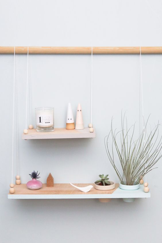 minimalist hanging shelves   two color block ones with a pastel edge on a wooden holder