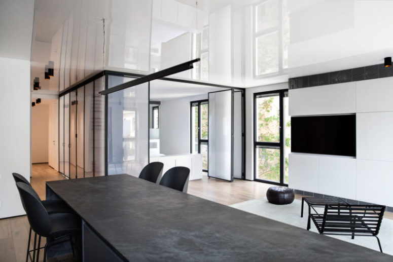 The bedroom is hidden within a plastic cube that lets light in and still is rather private