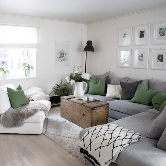 a large grey sectional sofa saves a lot of space and doesn't make the owners clutter the room with lots of chairs