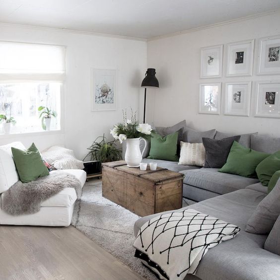 a large grey sectional sofa saves a lot of space and doesn't make the owners clutter the room with lots of chairs