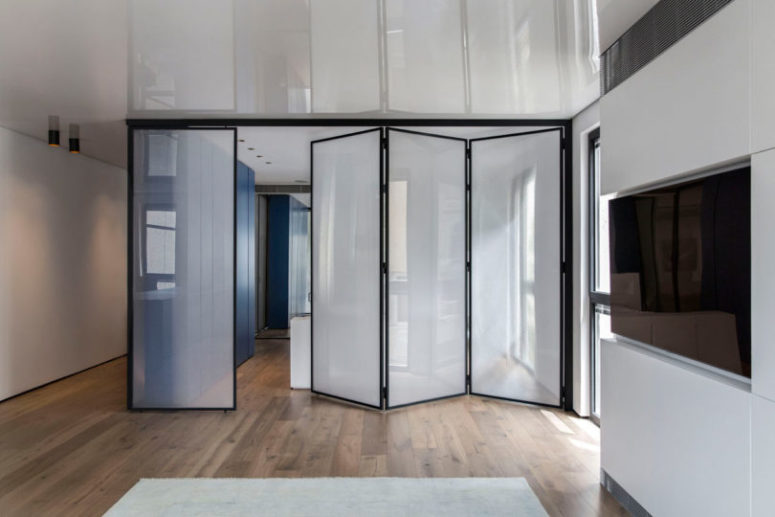 The bedroom has several dividers that can work as doors
