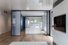 08 There’s also a bathroom integrated into the bedroom and a large sleek blue unit for storage