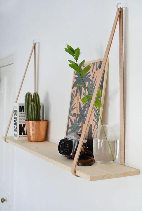 chic wood and leather hanging shelves are fast to make and leather adds texture to the space