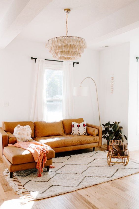 such placing of the sofa in front of the window makes reading here especially comfortable and cool